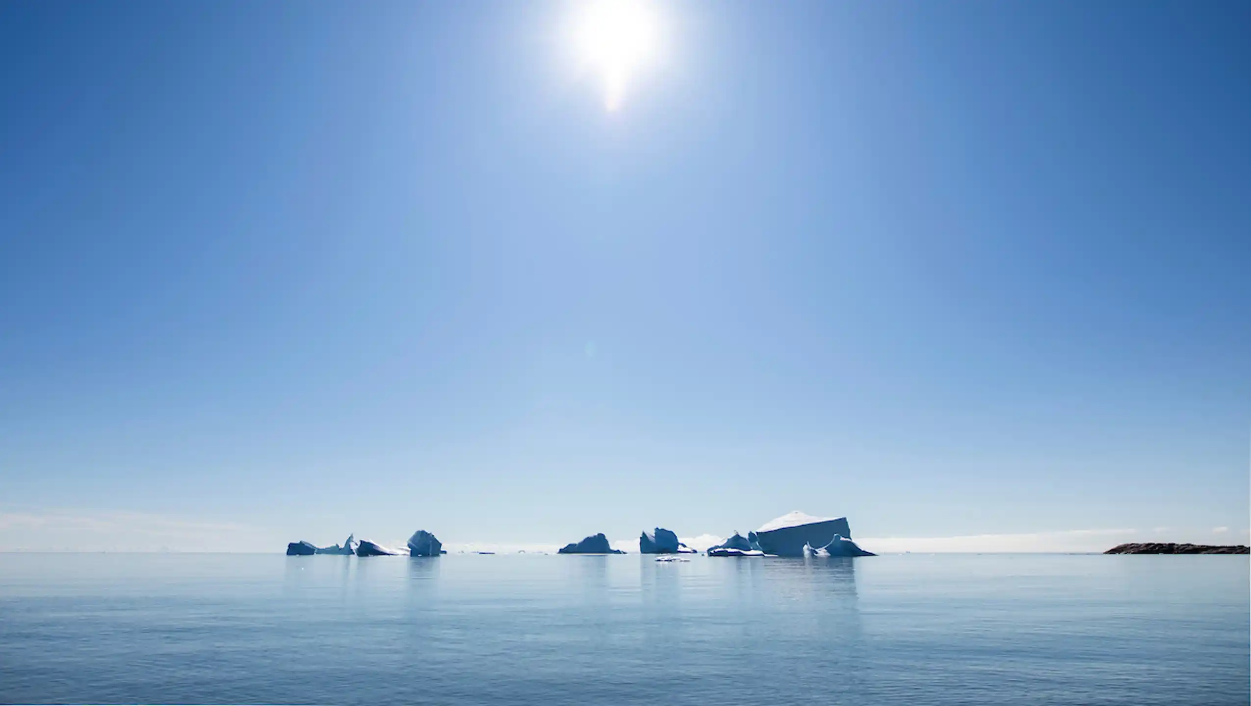 Icebergs Under Sun. Aningaaq Rosing Carlsen Visit Greenland