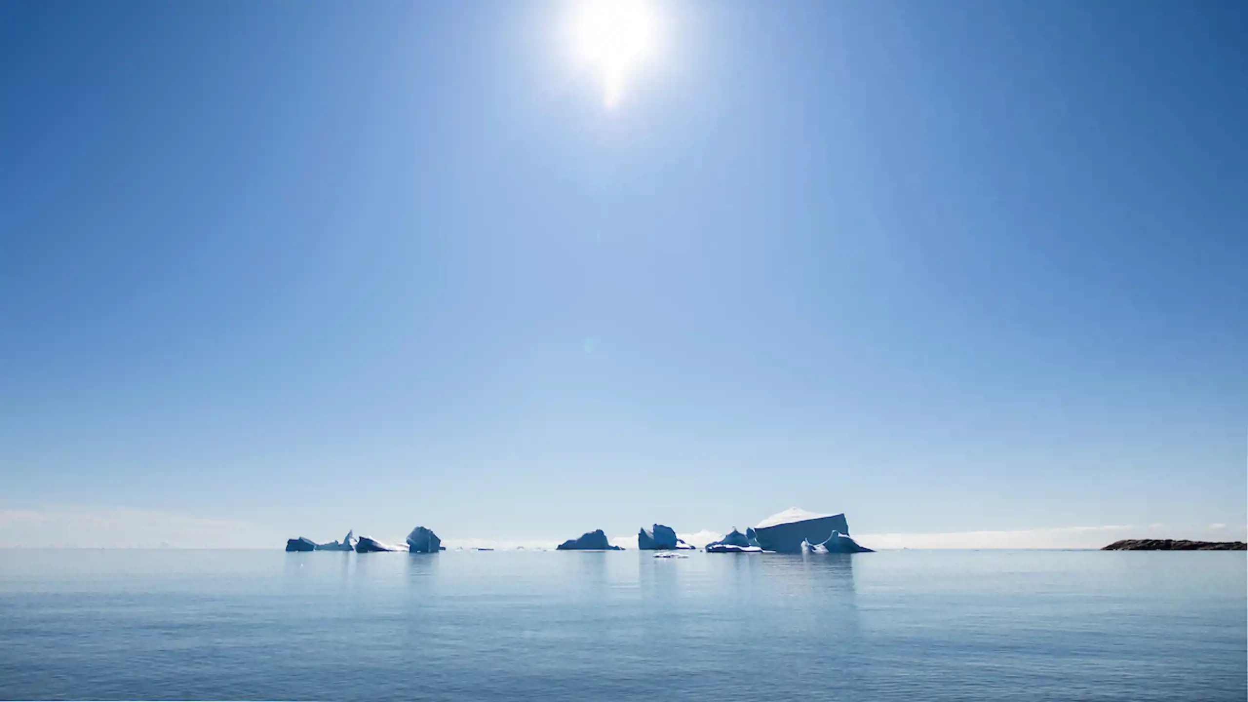 Icebergs Under Sun. Aningaaq Rosing Carlsen Visit Greenland