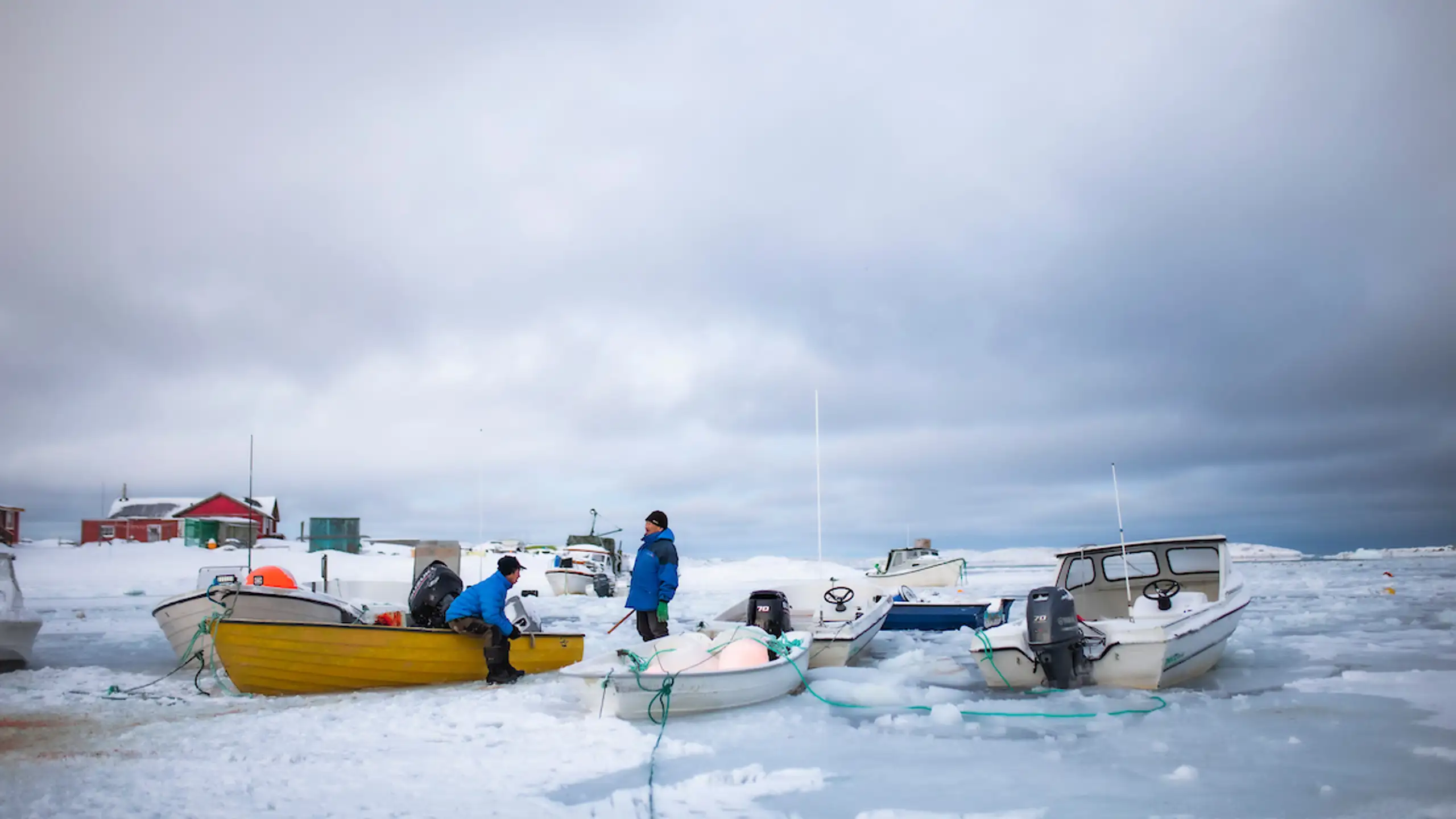 Locals In Frozen Harbour, Aasiaat. Photo Aningaaq R. Carlsen, Visit Greenland