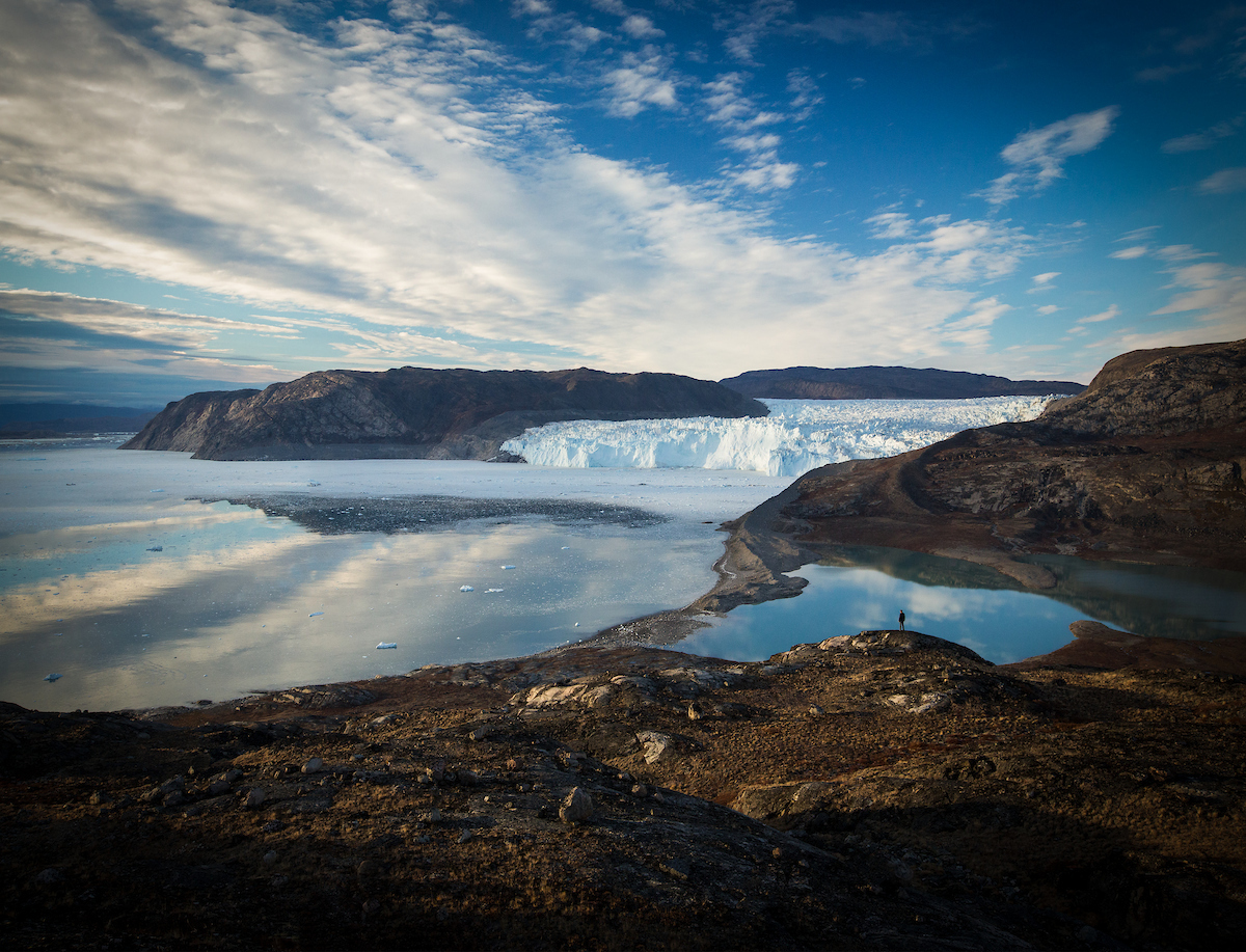 Hiker Looks Over Eqi Glacier. Photo Paul Zizka , Visit Greenland