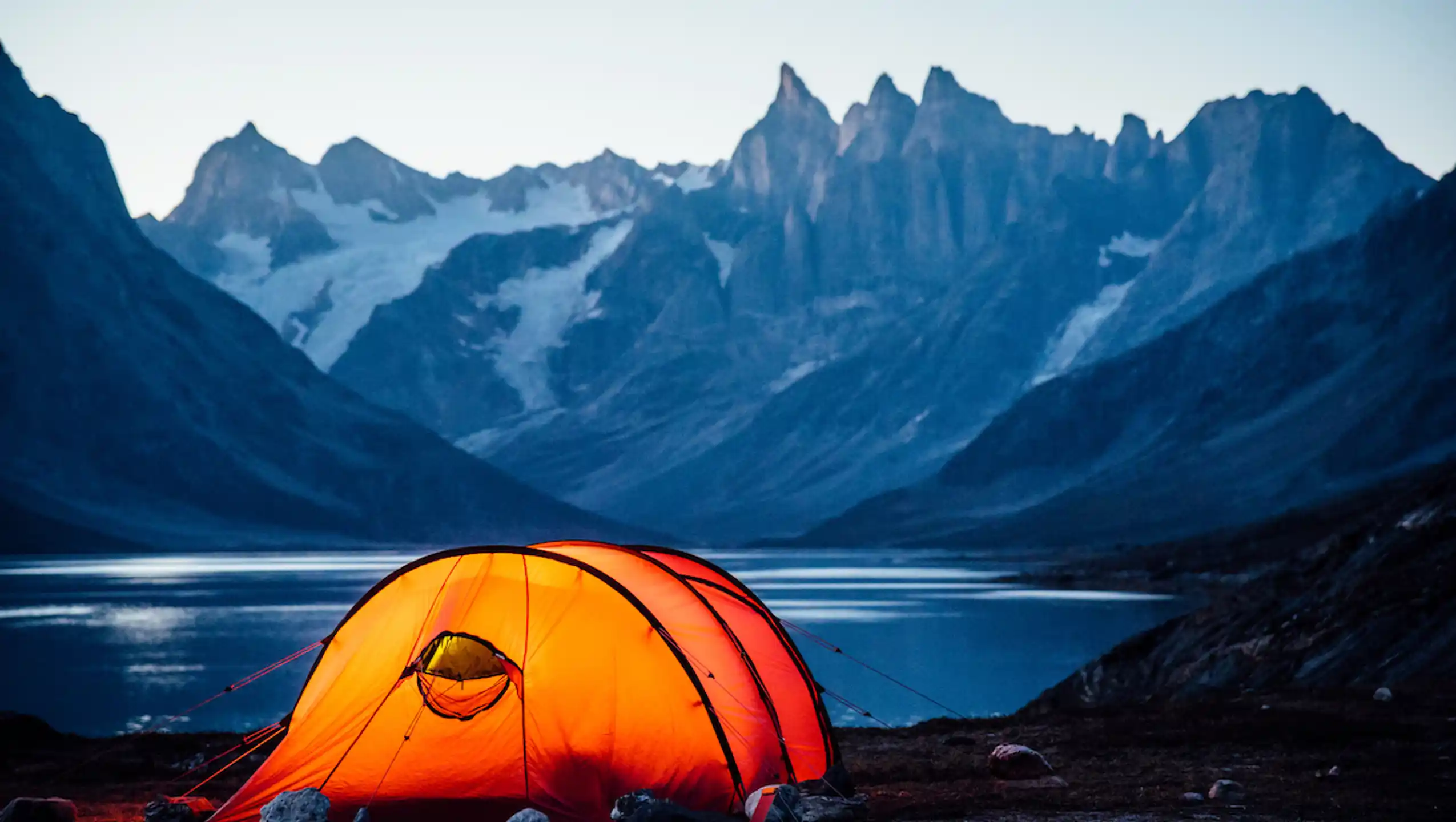 Lit Tent At Sunset In Tasiilaq Fjord. Photo Chris B. Lee, Visit Greenland